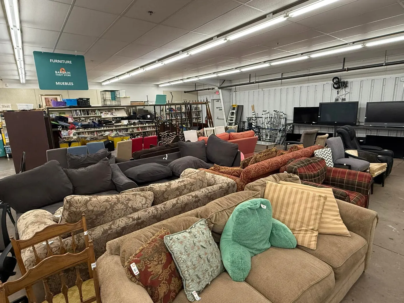 Used sofas and loveseats on the furniture floor at Bargain Thrift Store in Oklahoma City