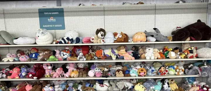 Plush toys under the Toys and Games sign at Bargain Thrift Store